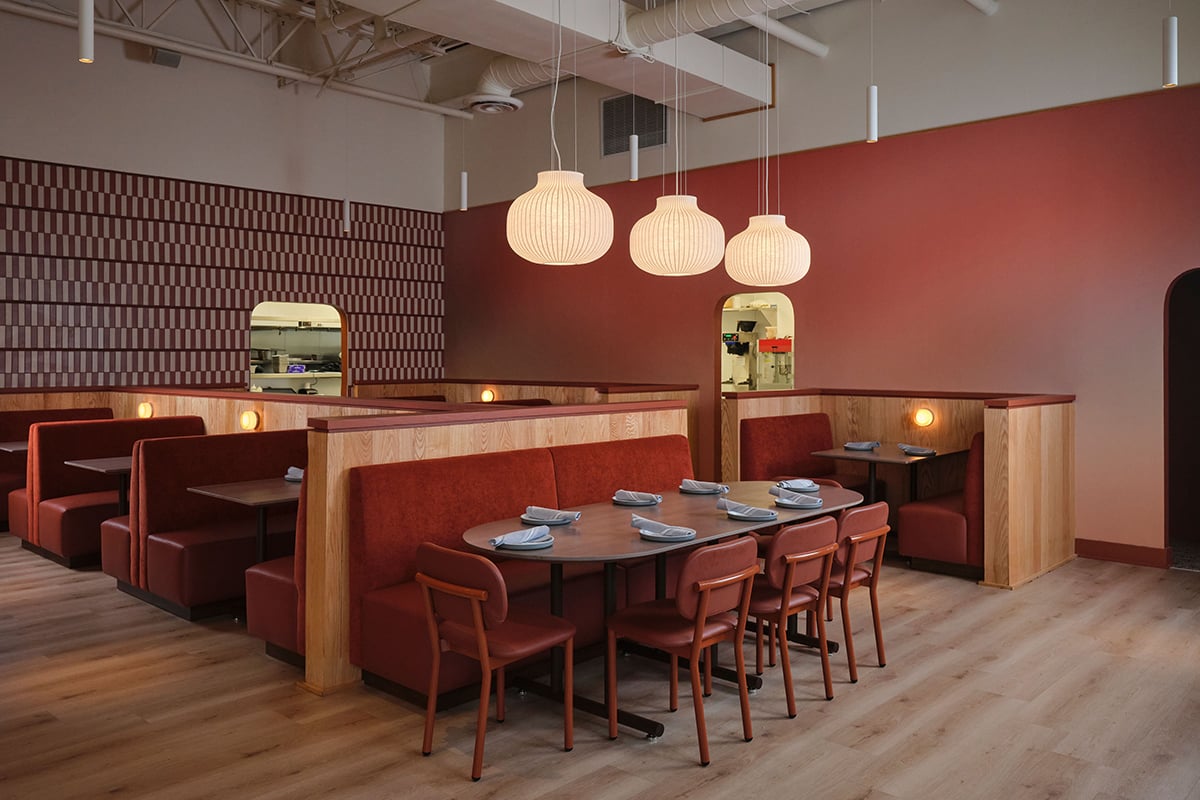 Contemporary chairs in a vibrant contemporary restaurant with splashes of pinks and reds